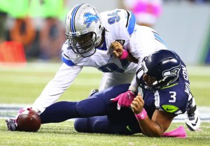 Lions defensive lineman Ezekiel Ansah forces a fumble from Seahawks quarterback Russell Wilson during the fourth quarter as the Seattle Seahawks take on the Detroit Lions at CenturyLink Field on Monday, October 5, 2015, in Seattle, Wash. (John Lok / The Seattle Times)